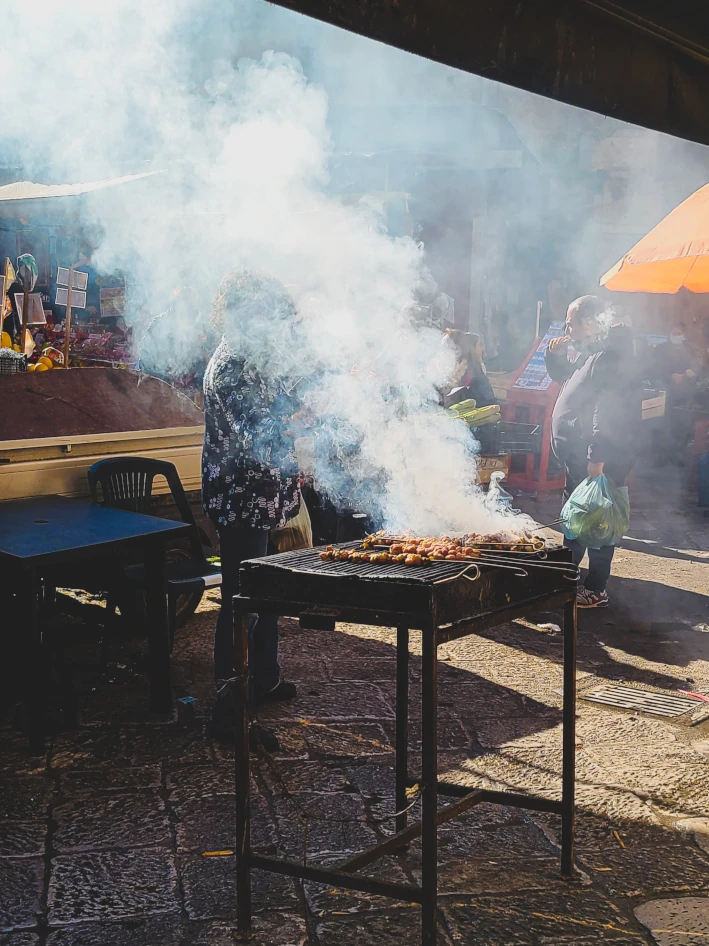 Gut skewers stigghiola on a grill