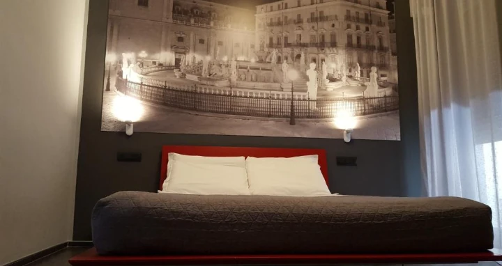 Picture of bed in Palermo Hotel Alma