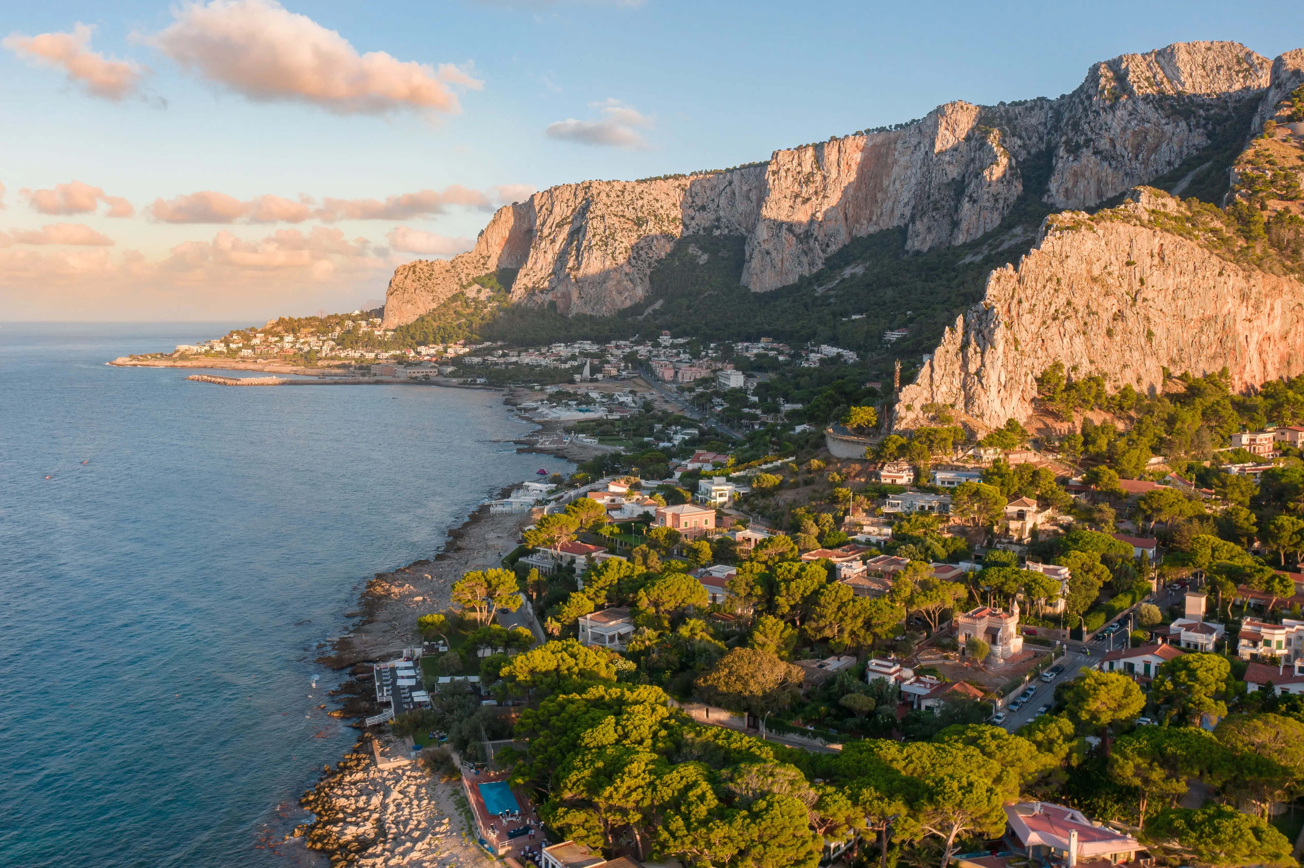 Palermo hotel guide image shows Sicilian coastline