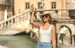 Woman makes Italian hand gesture at the Fontana Pretoria