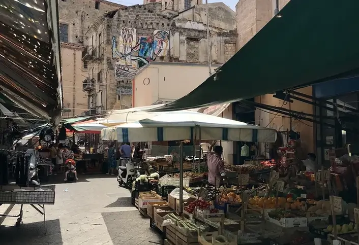 Ballarò market with a church in the background