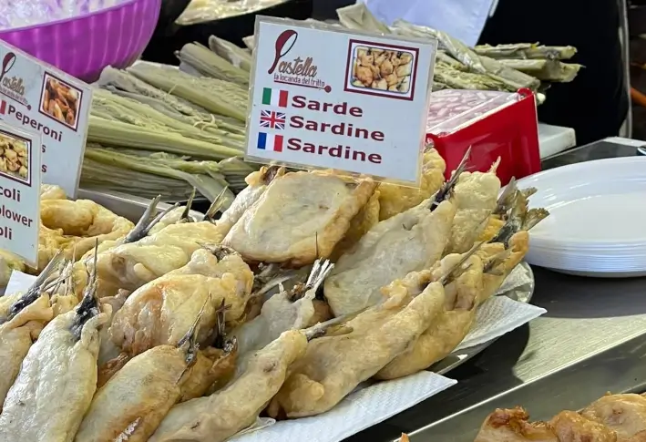 Fried sardines on a market stall