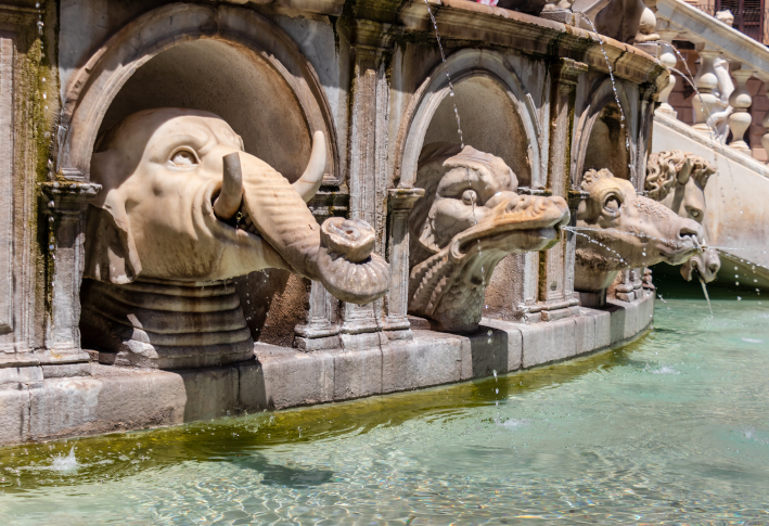 Water feature of animal and mystical figures decorates the central column of the Fontana Pretor