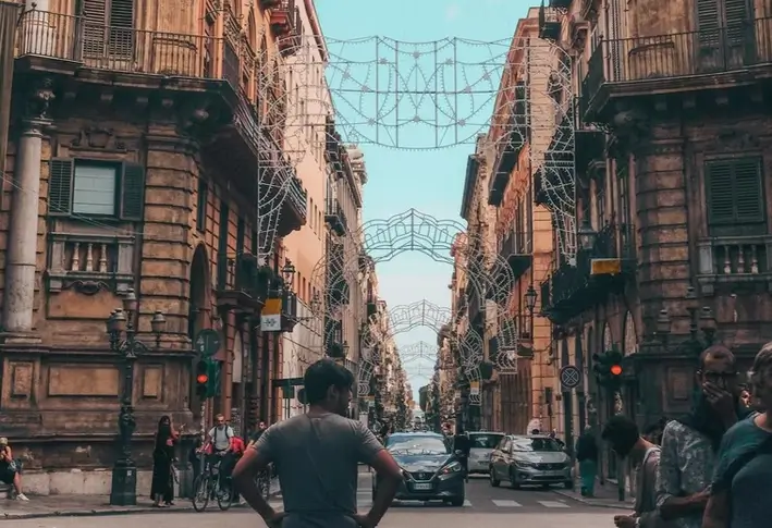 A man stands at the Quattro Canti crossing