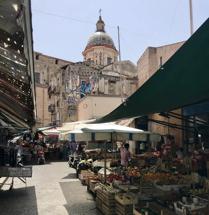 Ballarò market with a church in the background